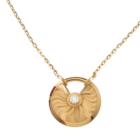 cartier amulette yellow gold necklace.